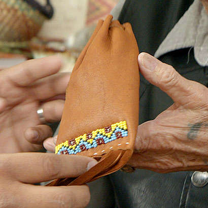 hands trading a bag of cansasa