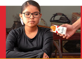 young girl saying no to commercial tobacco
